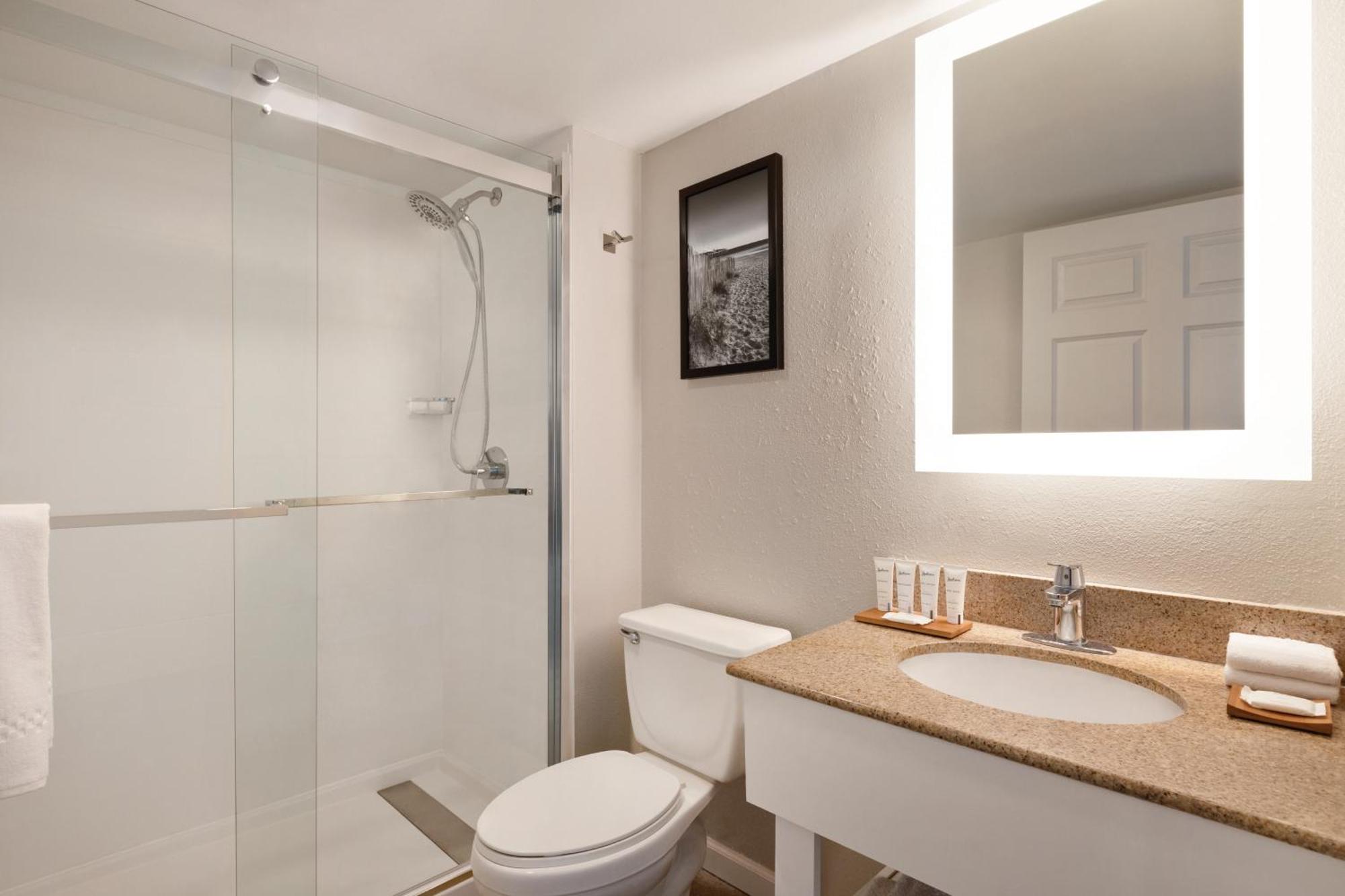 Two-Bedroom Penthouse Suite with One King Bed & Two Double Beds, Kitchen, & Living Room - Non Smoking