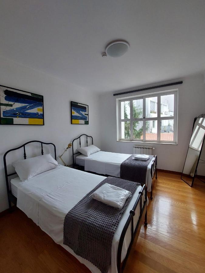 Quarto Standard com 2 Camas de Solteiro e Banheiro Compartilhado
