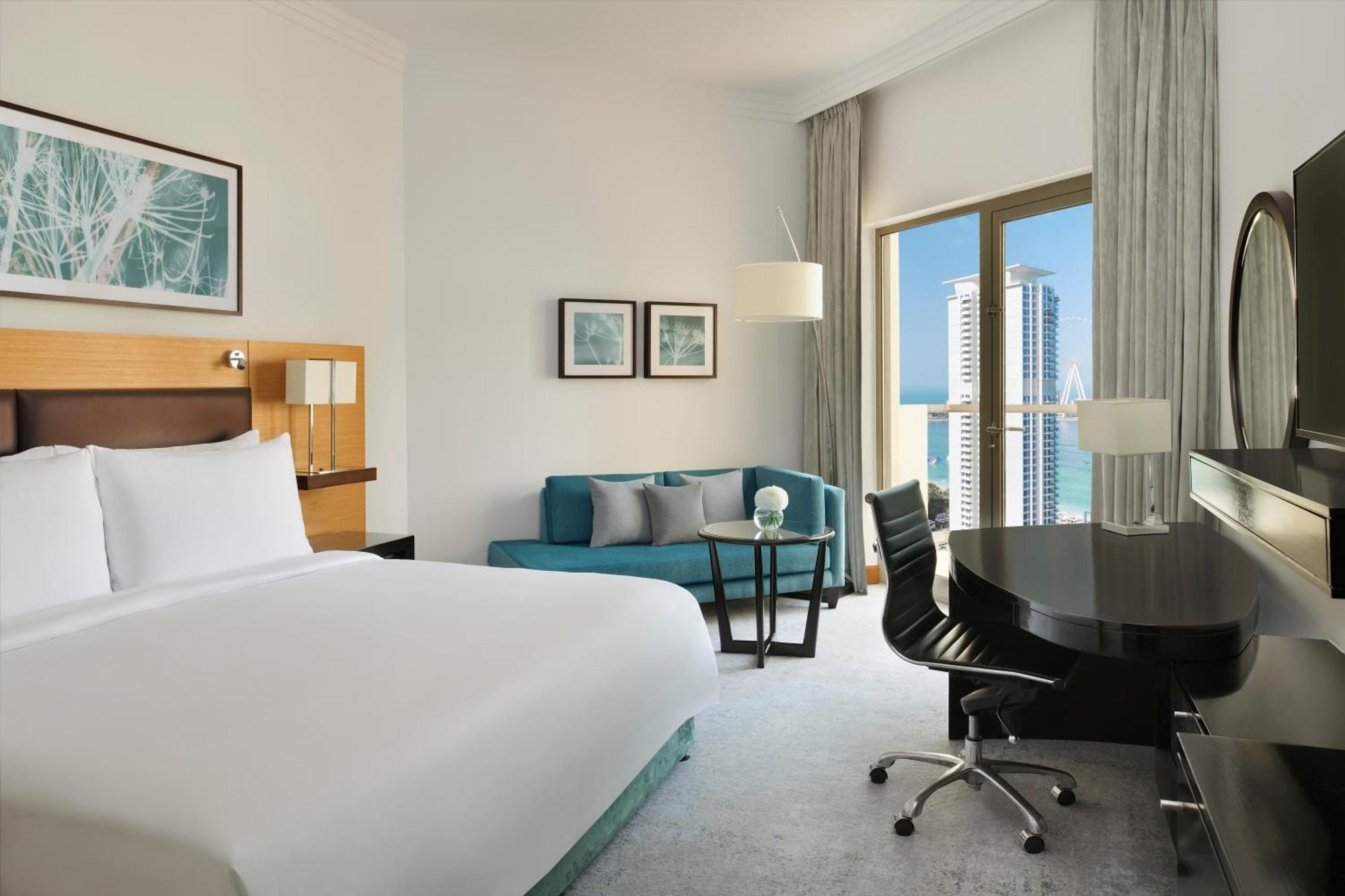 Deluxe Kamer met Kingsize Bed en Balkon - Gedeeltelijk Uitzicht op Zee