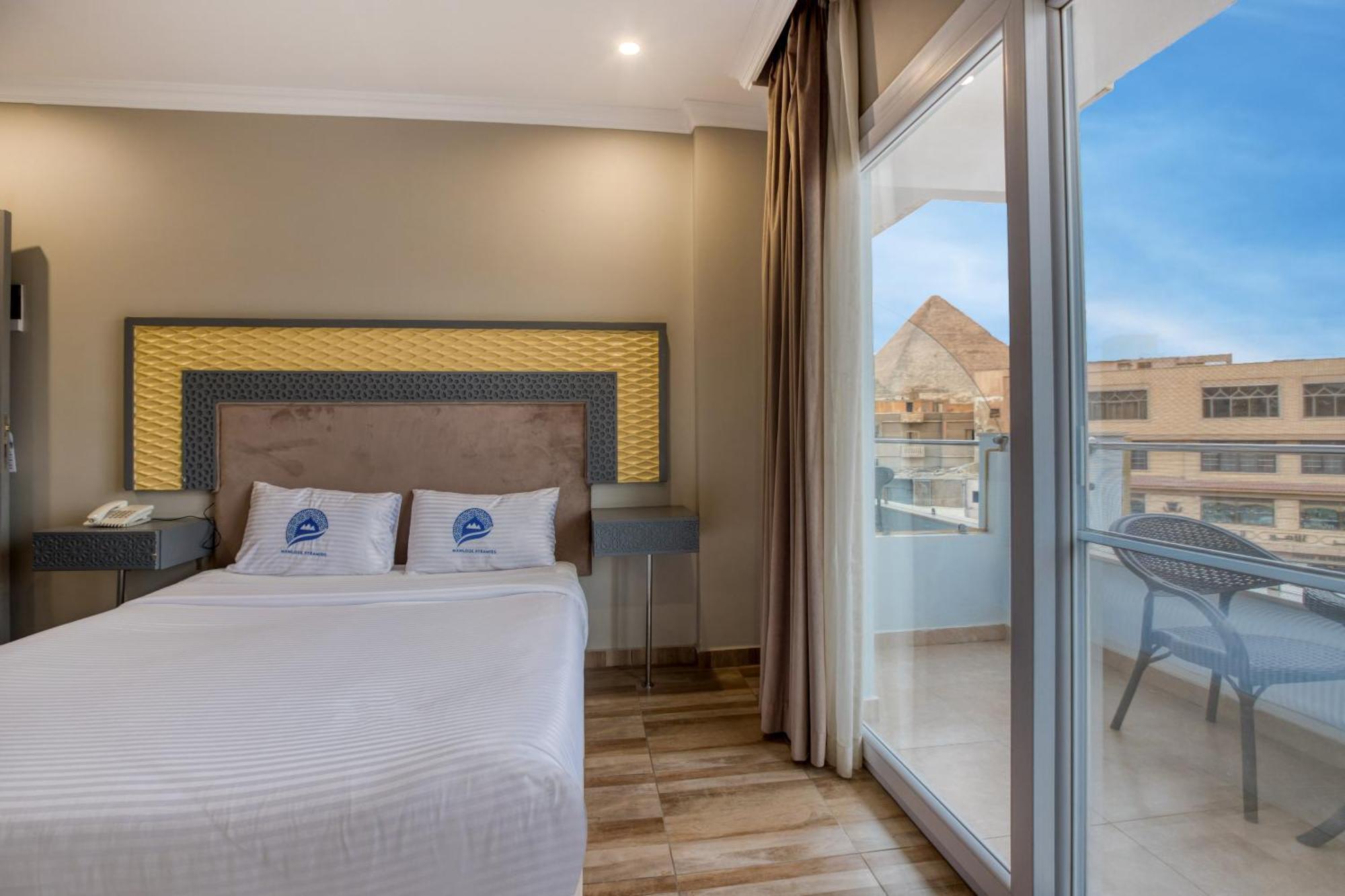 Superior Queen Room Partial Pyramids View & Balcony
