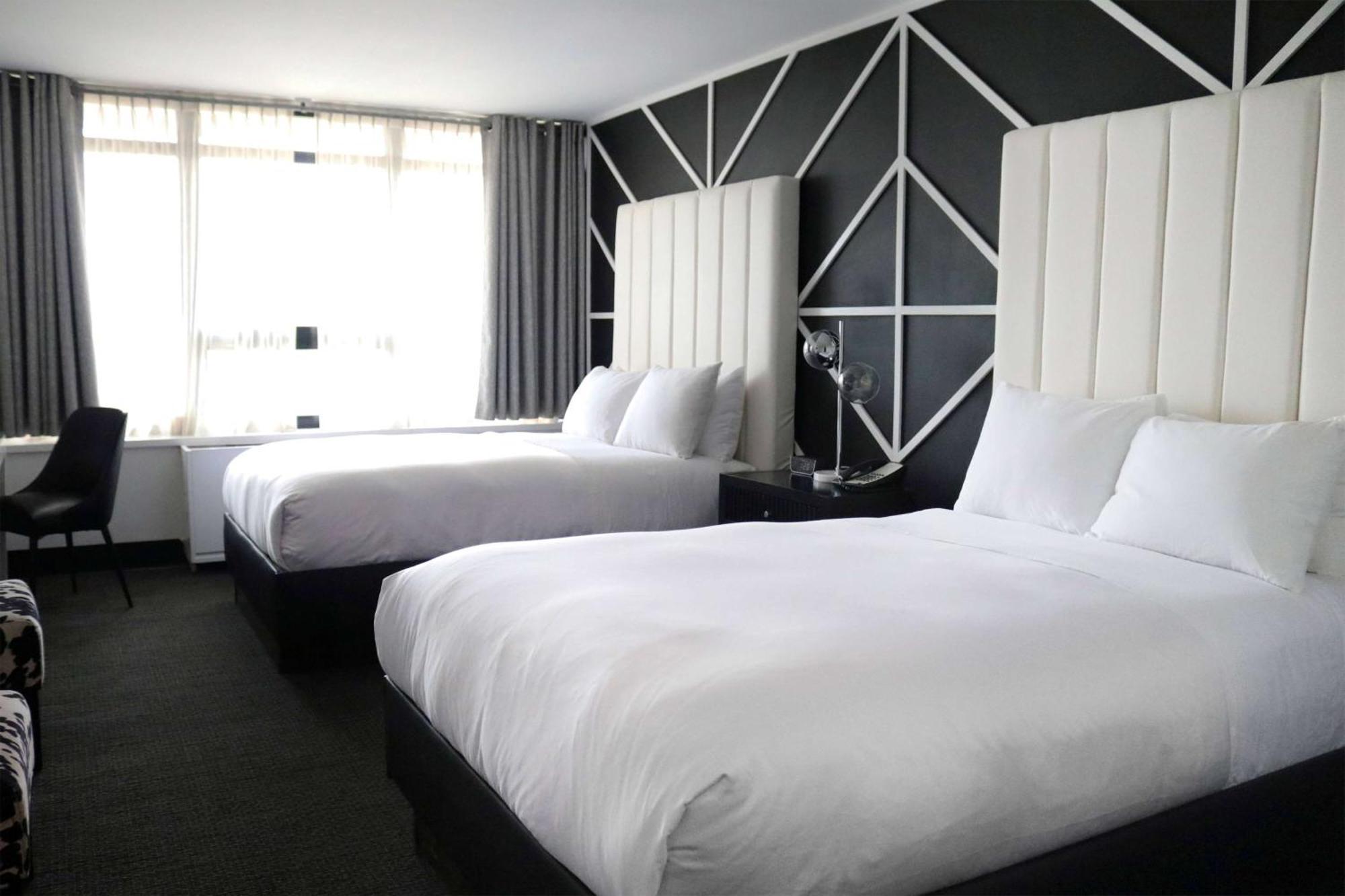 Double Room Mobility or Hearing Access Two Double Beds andTub Grab Bars Non-Smoking