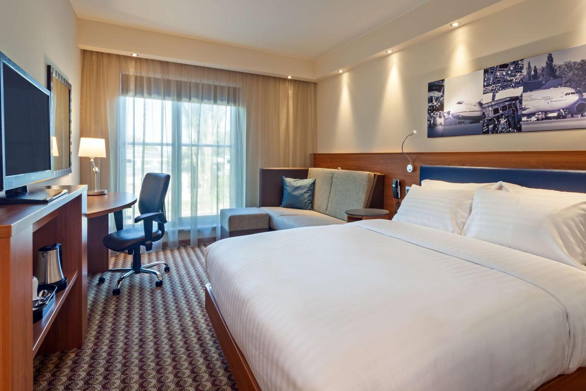 Kamer met Queensize Bed en Slaapbank