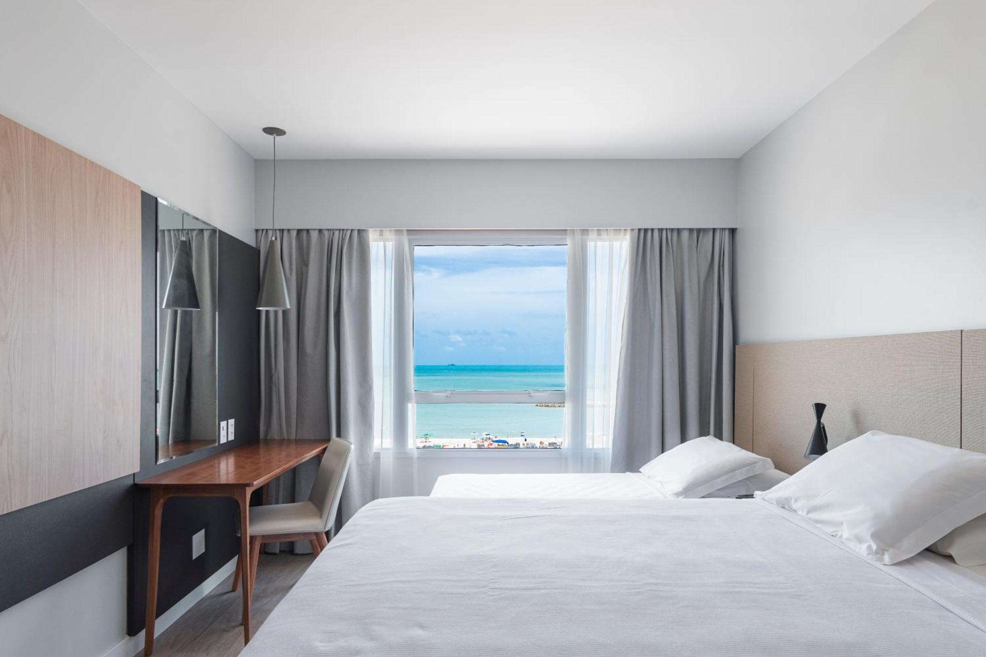 Quarto Triplo Superior casal vista mar