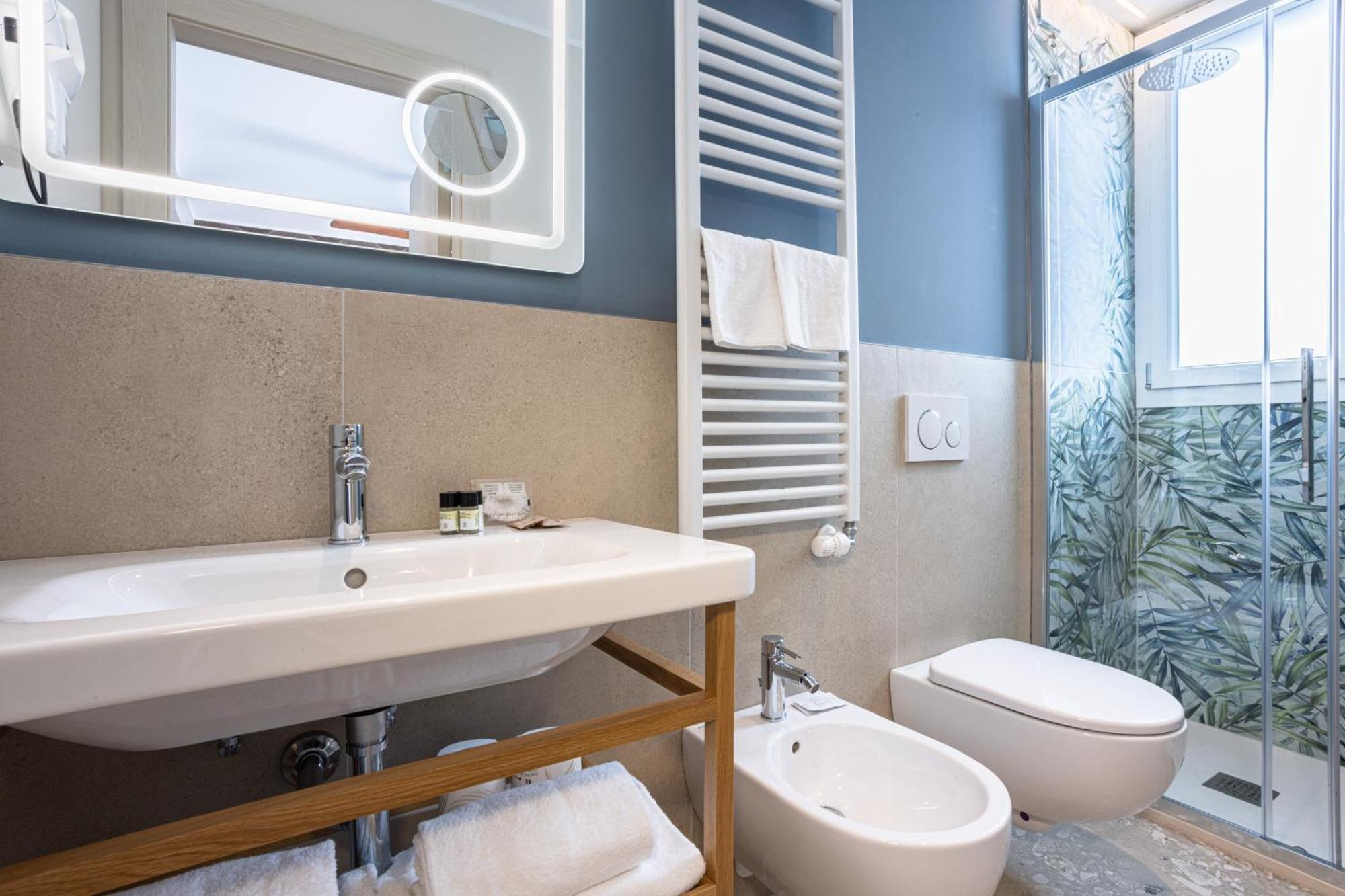 Deluxe Dreibettzimmer mit Balkon