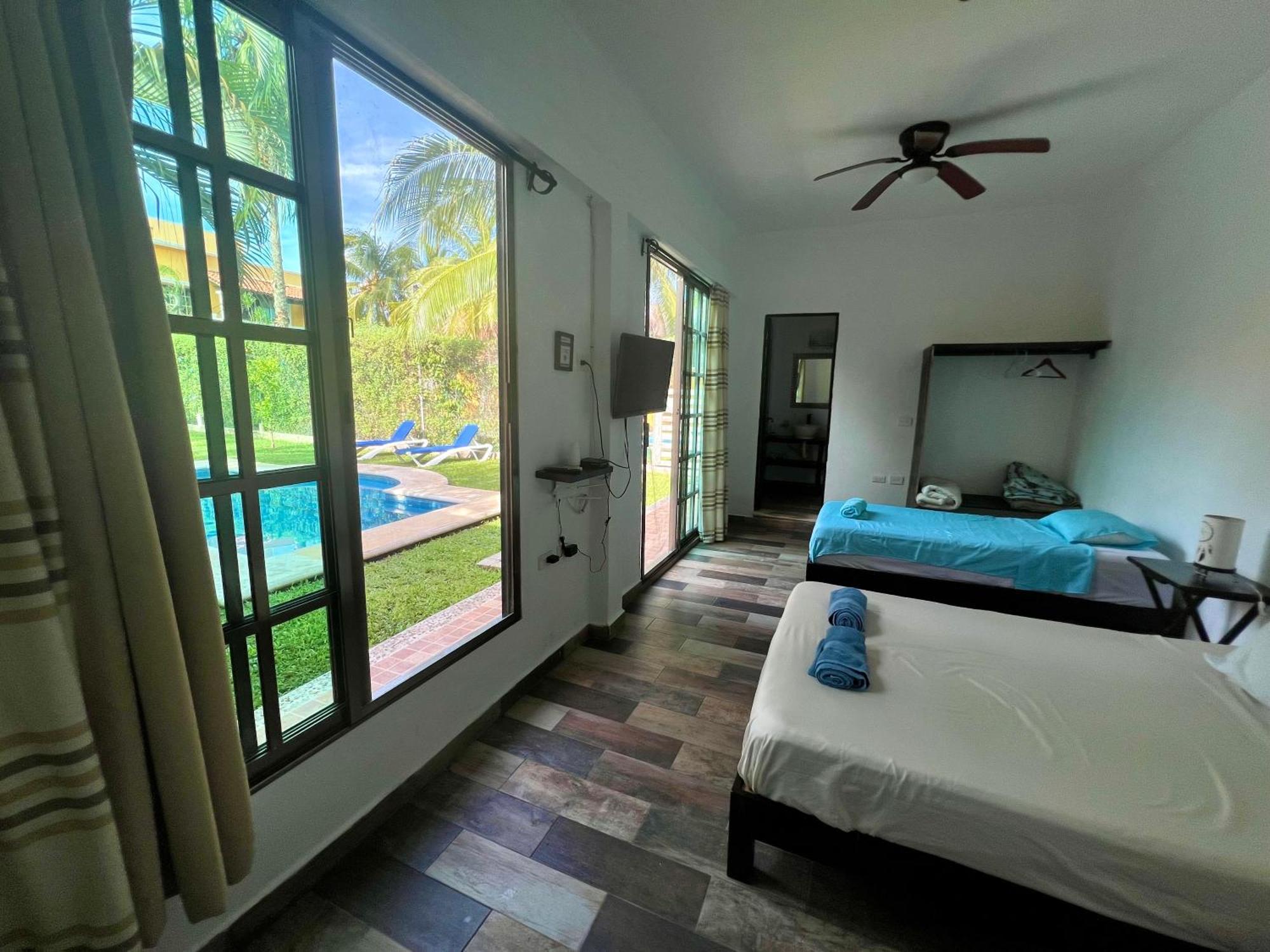 Quadruple Room with Balcony and view to the garden and pool,1607702480:JPEG