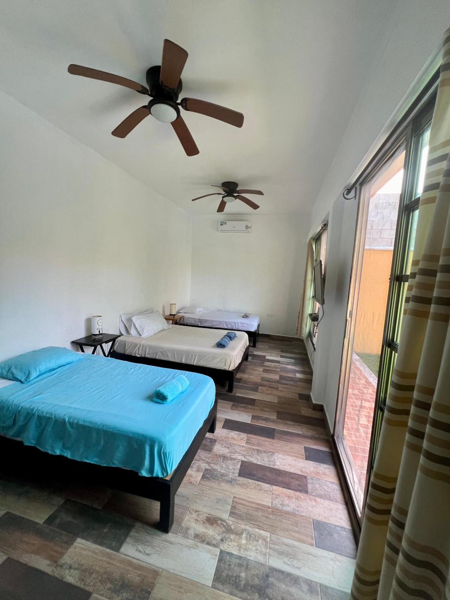 Quadruple Room Balcony view to the garden pool