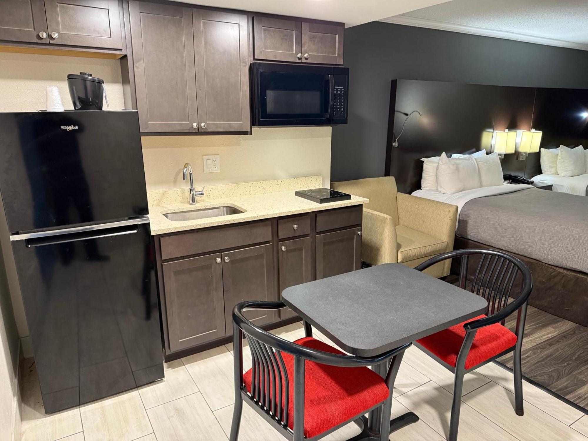 King Suite with One King and Two Double Beds - Non-Smoking