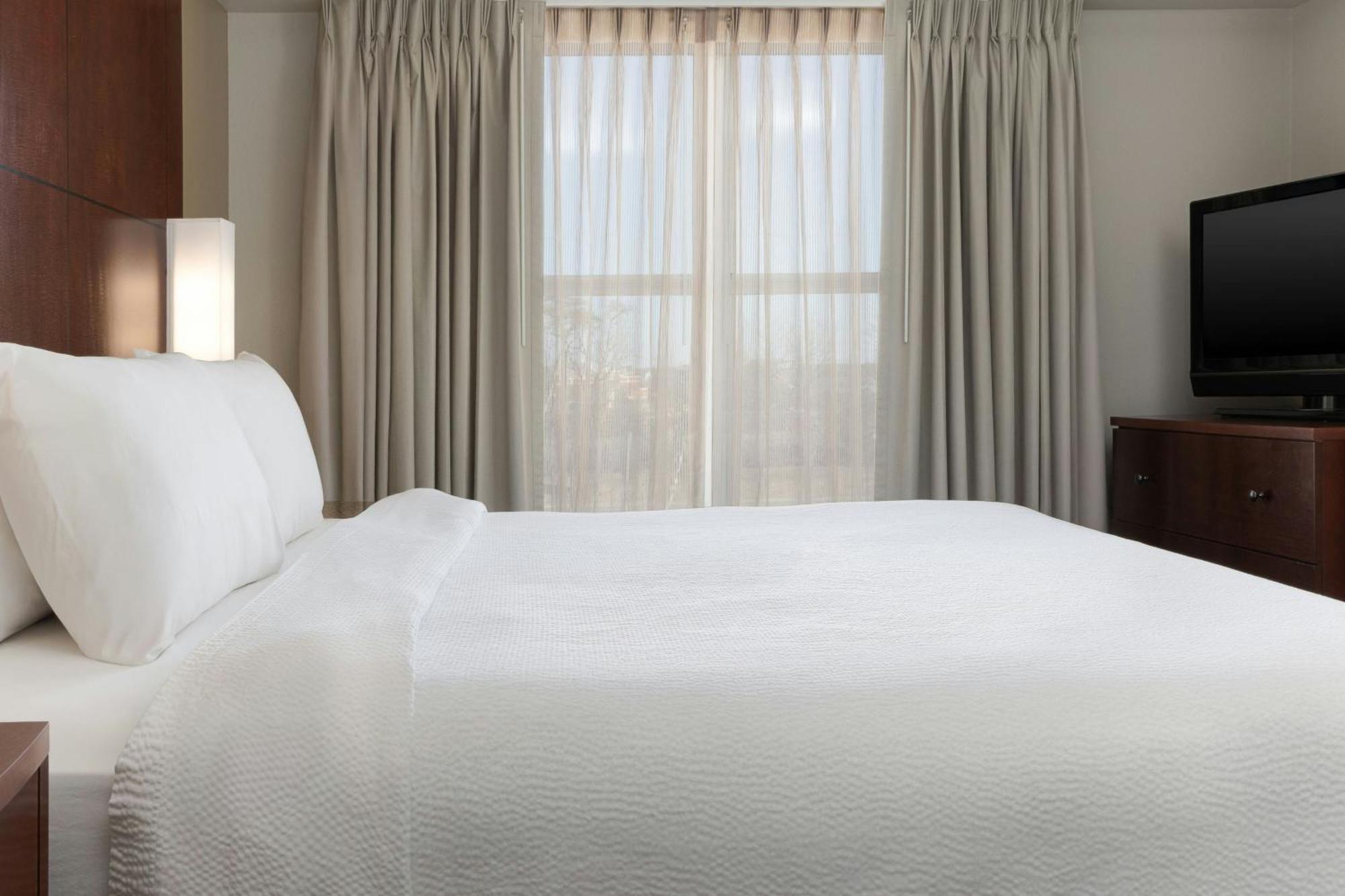 One-Bedroom King Suite Sofa Bed Mobility or Hearing Accessible Roll Shower