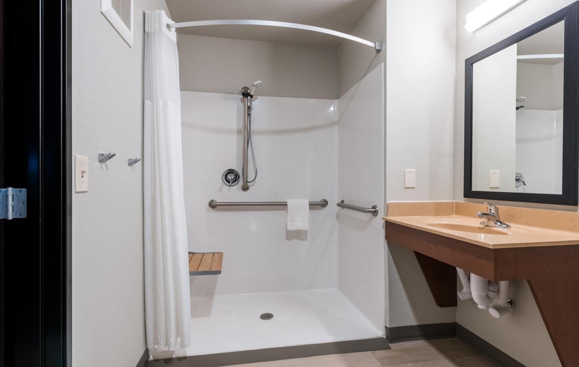 Queen Room Hearing & Mobility Accessible Roll Shower