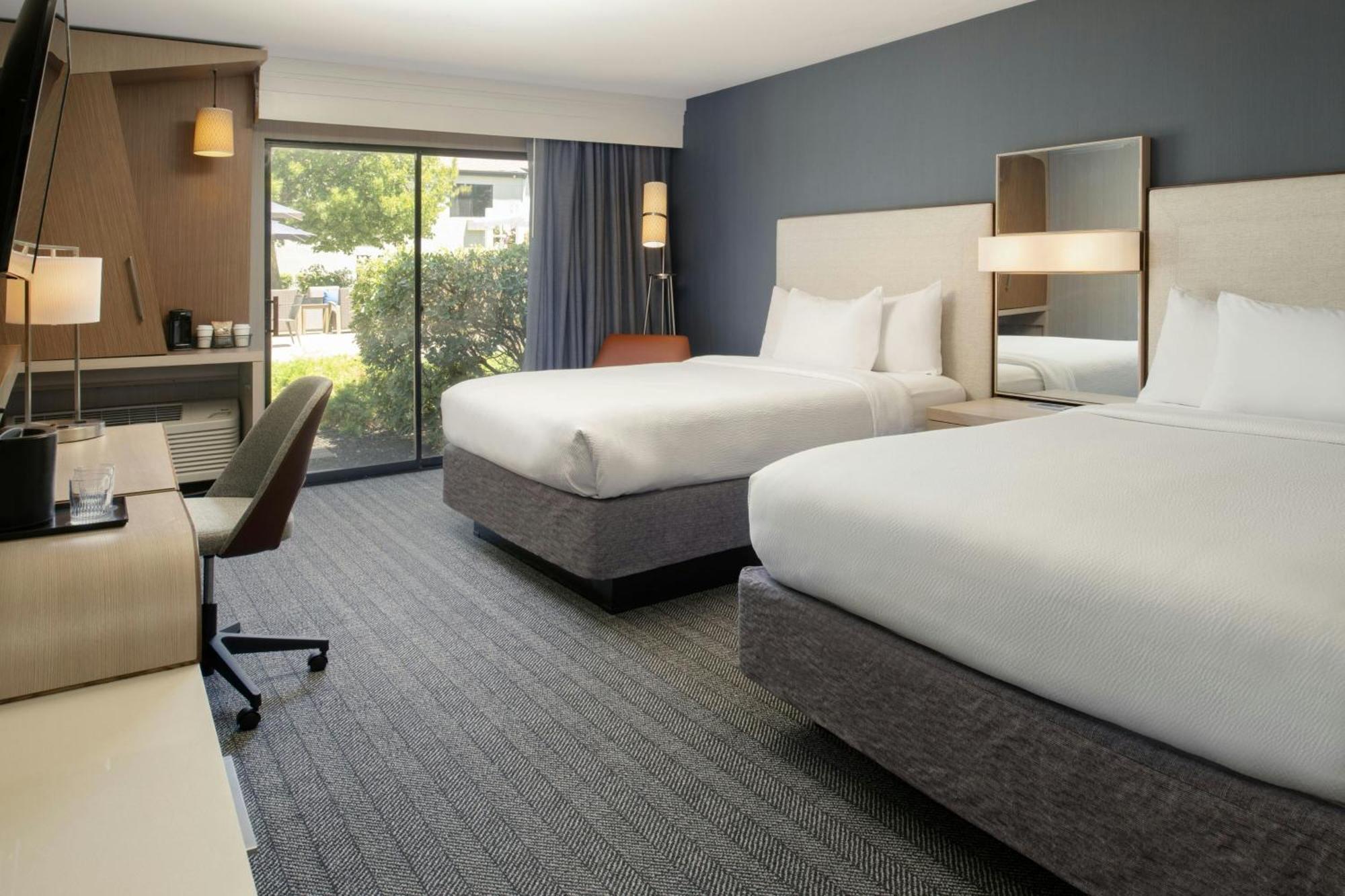 Queen Room Two Queen Beds Roll Shower Mobility Access or Hearing Accessible