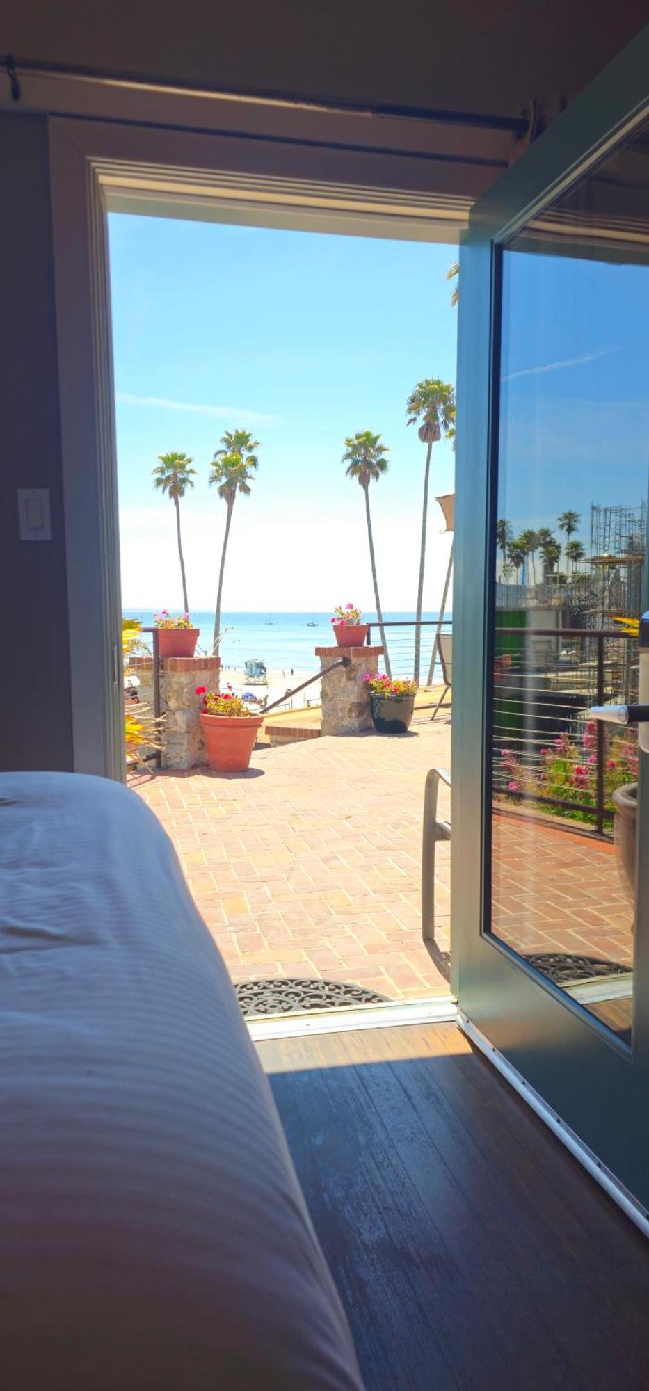 Partial Ocean View Two Queen Beds Shared Patio