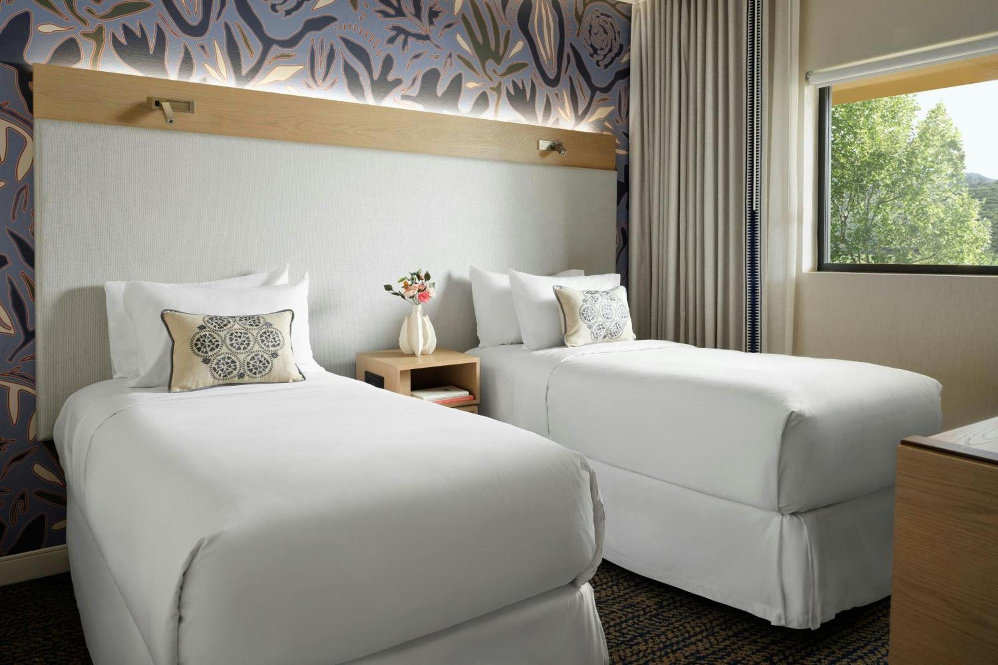 One-Bedroom Family Suite One King Bed Two Single Beds Roll Shower or Mobility Hearing Accessible