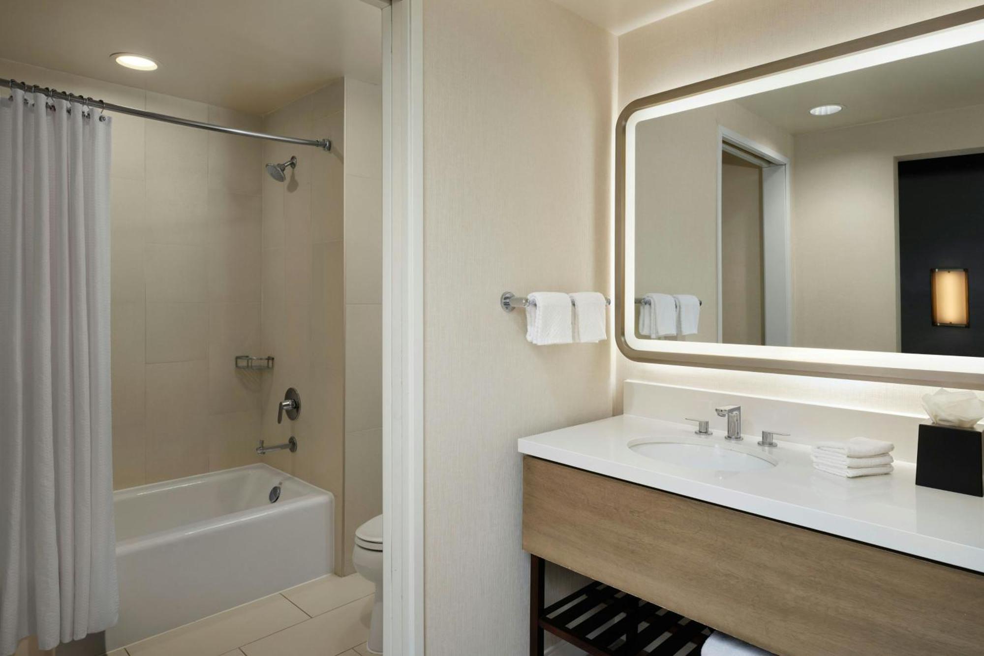 One-Bedroom Family Suite One King Bed Two Single Beds Roll Shower or Mobility Hearing Accessible