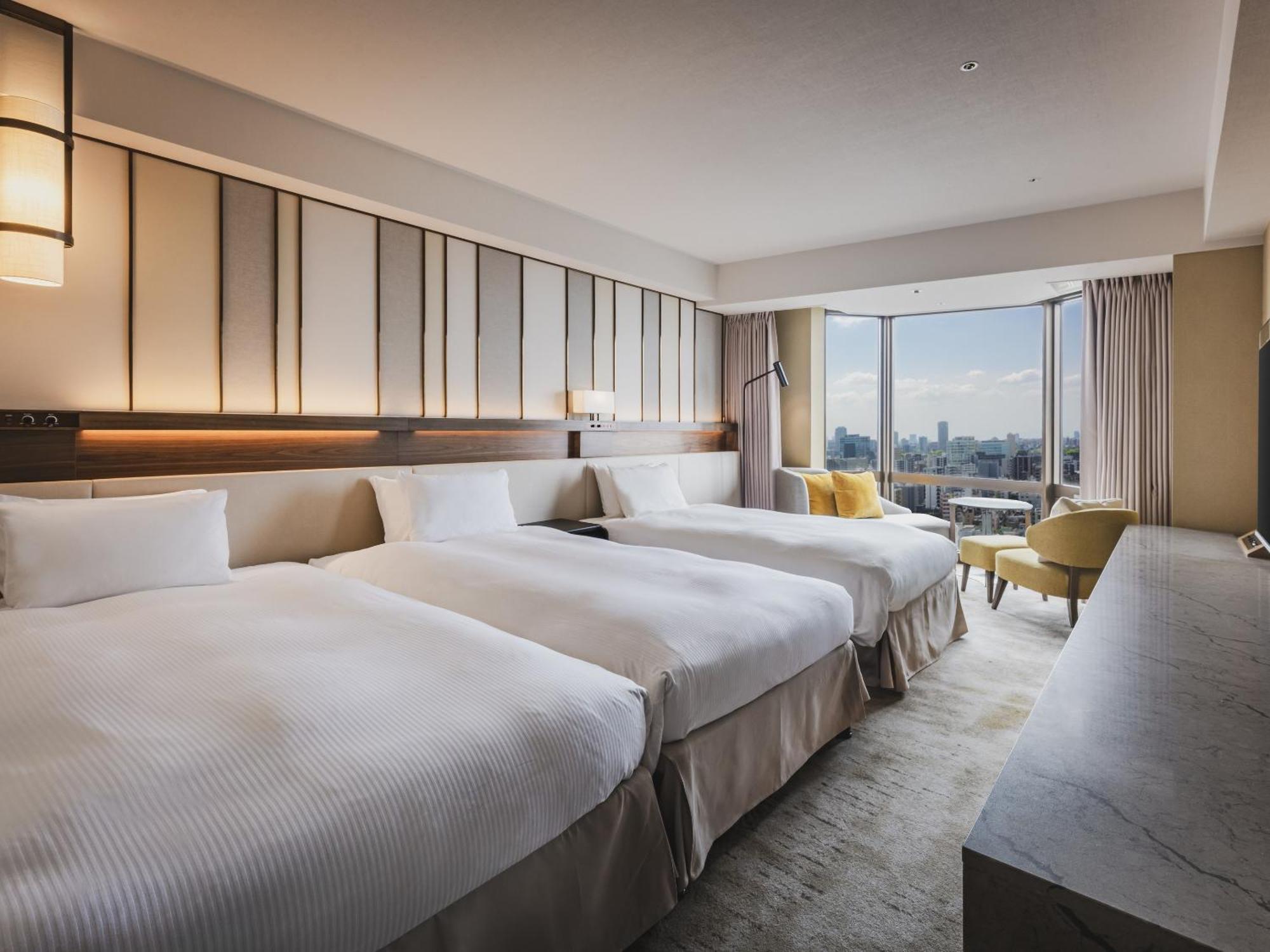 Habitación Doble con 2 camas Superior con vistas laterales a la ciudad y cama supletoria (3 adultos)
