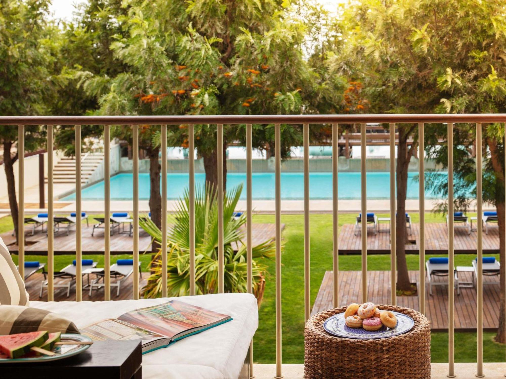 Deluxe King Room balcony pool view