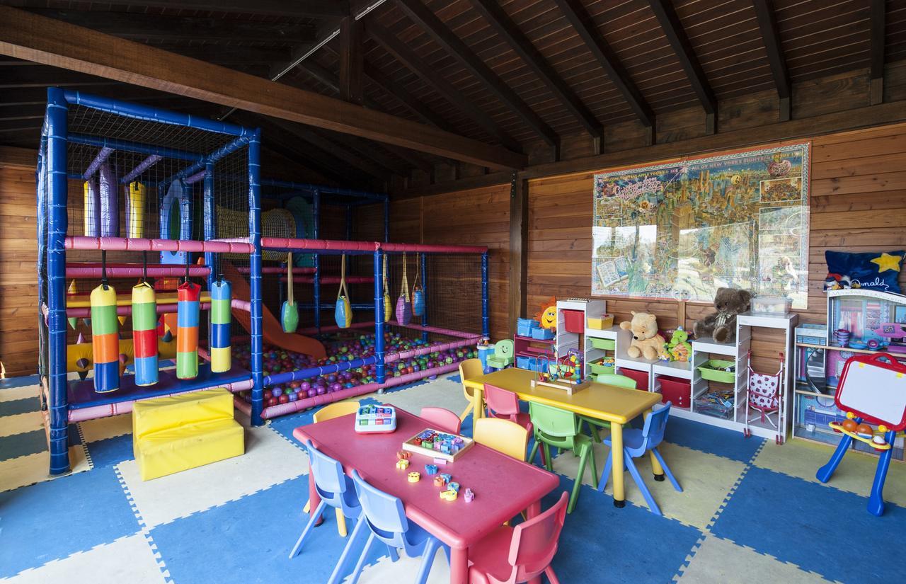 Habitación Familiar con jardín privado (2 adultos + 2 niños)