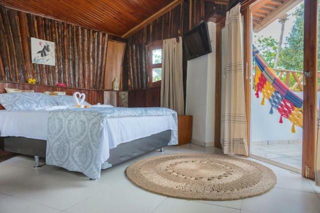Quarto com Cama Queen-Size e Varanda